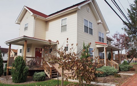 A house with a red door and a red roof.