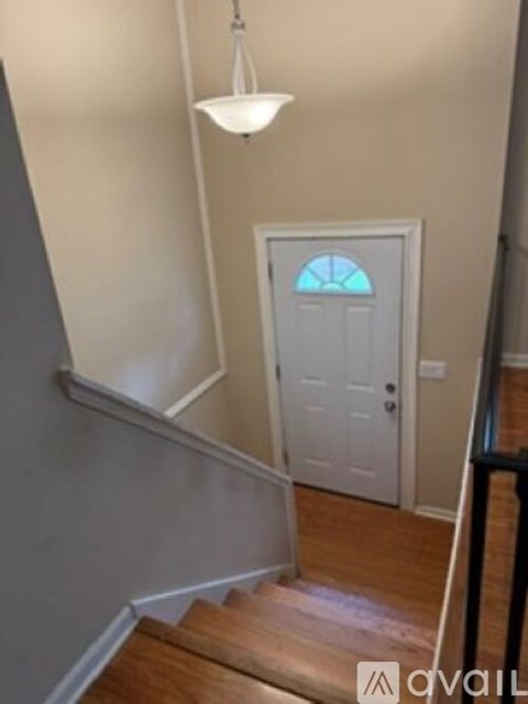 A white door with a blue window in the middle of it.