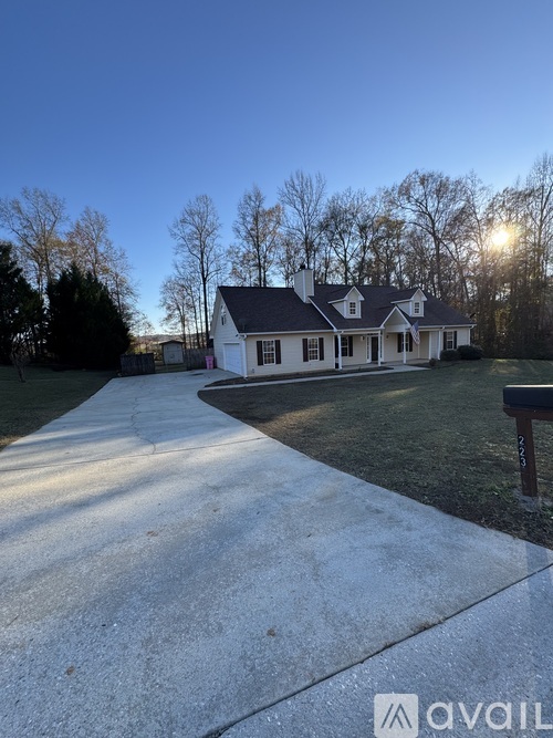 A house with a driveway in front of it.