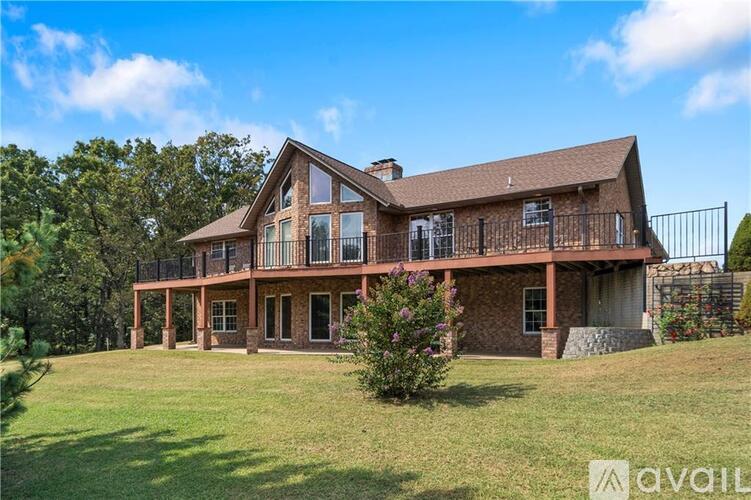 A large house with a porch and a balcony is for sale.