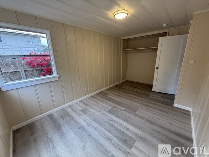 A room with a window and a door is shown.