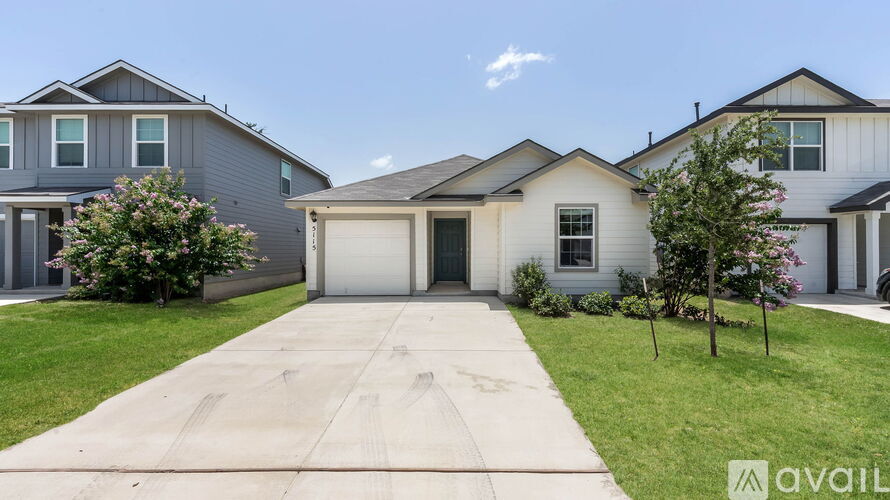 A house with a driveway in front of it.