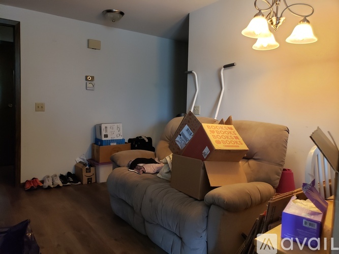 A room with a couch and a box on it.