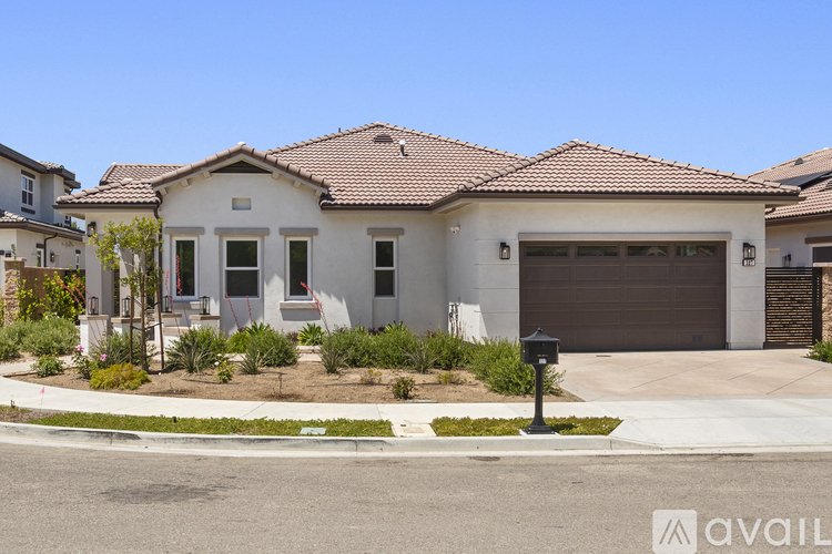 A house with a brown garage door is for sale.