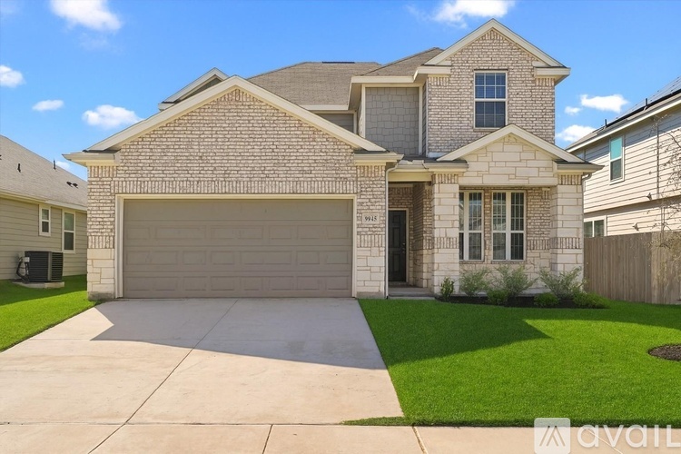 A two-story house with a garage is for sale.