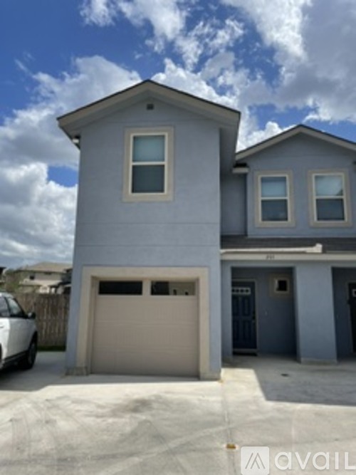 A two-story house with a garage is shown in the image.