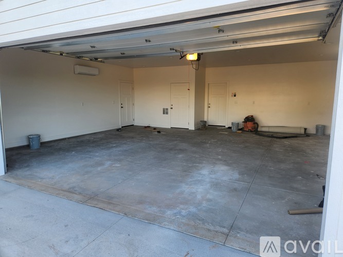 A person is working on a construction site inside a garage.