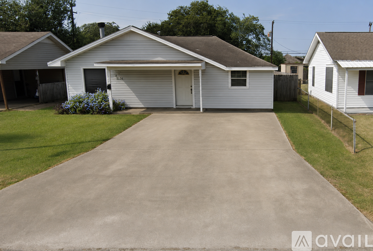 A house with a driveway in front of it.