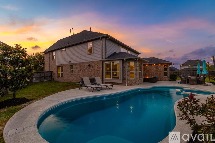 A house with a swimming pool in the backyard.