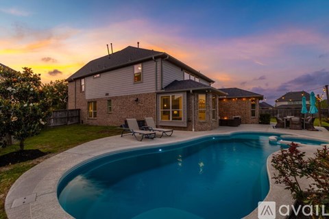 A house with a swimming pool in the backyard.