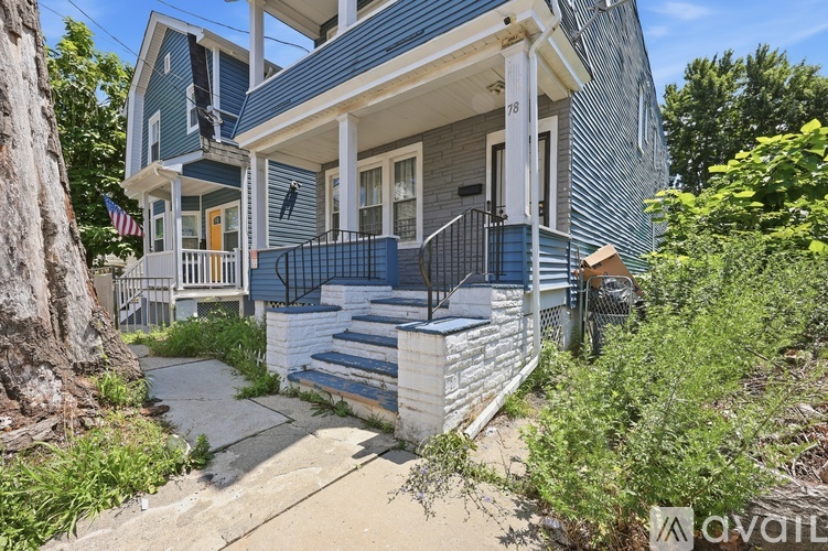 A house with a blue and white exterior is for sale.