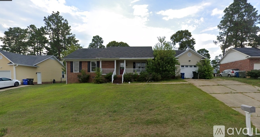 A house with a lawn in front of it.