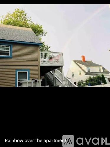 A rainbow appears to be shining down on a building.