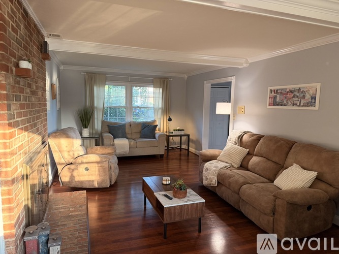 A living room with a fireplace and a couch.