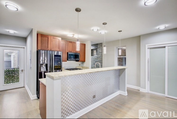 A kitchen with a white counter and wooden cabinets.