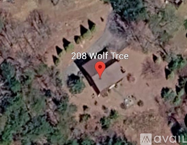 A satellite image shows a location named 208 Wolf Tree.