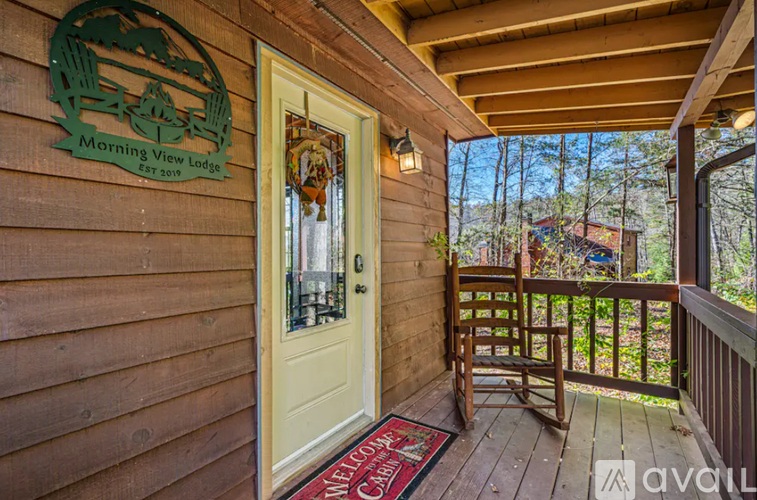 A wooden building with a sign that says Morning View Lodge.