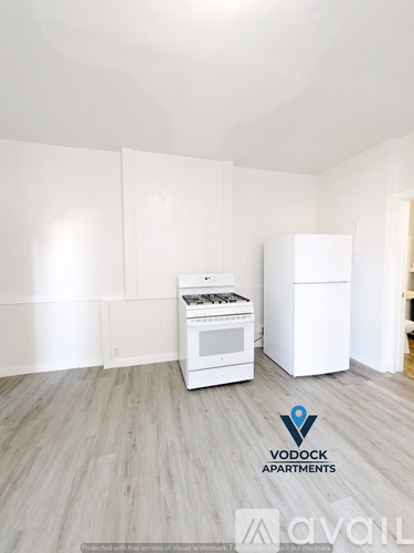A Vodock Apartments advertisement shows a white kitchen with a stove and a refrigerator.