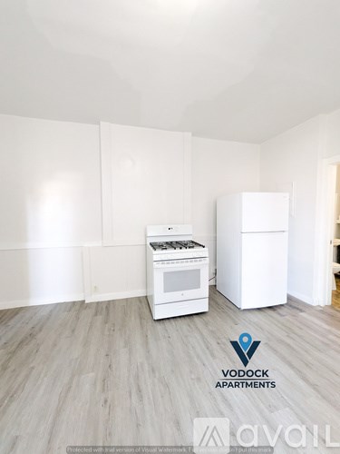 A Vodock Apartments advertisement shows a white kitchen with a stove and a refrigerator.