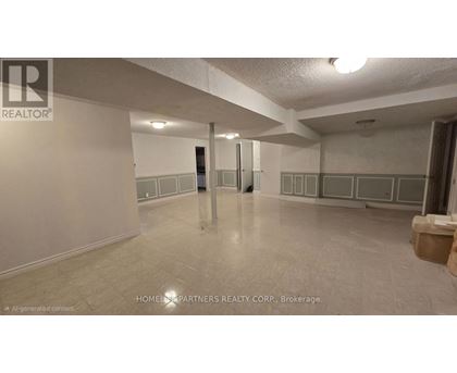 A spacious room with a tiled floor and white walls, with a door in the middle of the room.