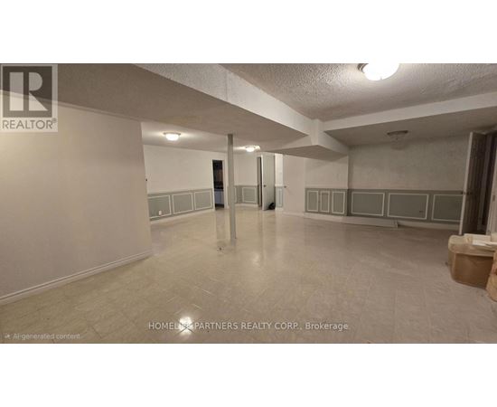 A spacious room with a tiled floor and white walls, with a door in the middle of the room.