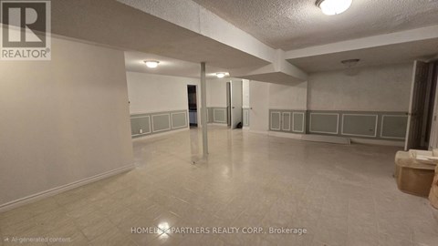 A spacious room with a tiled floor and white walls, with a door in the middle of the room.