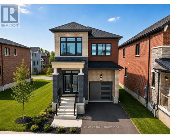 A modern house with a brick facade and a large front yard.