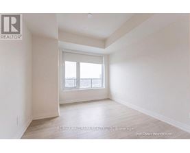 A spacious room with a window and a door is available for rent.