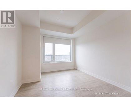 A spacious room with a window and a door is available for rent.