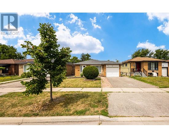 A tree stands in front of a house with a sign that says REALTOR.