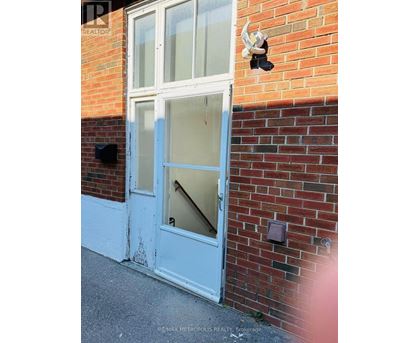 A white door with a glass panel is closed.