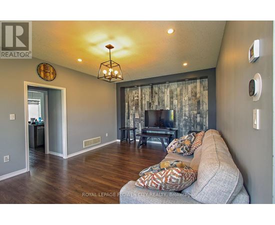 A living room with a couch and a television.