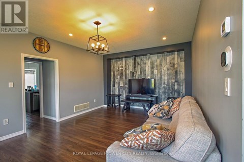 A living room with a couch and a television.