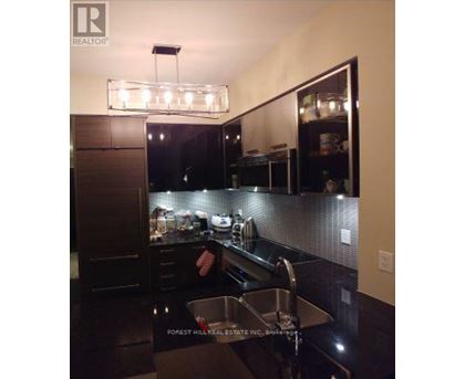 A kitchen with a sink and a counter.