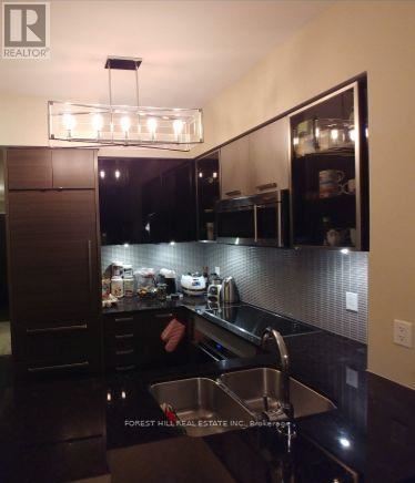 A kitchen with a sink and a counter.