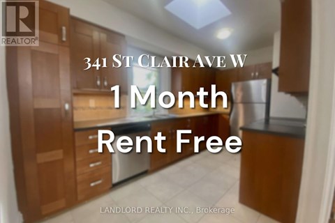 A sign advertising a 1 month rent free offer from Landlord Realty Inc.