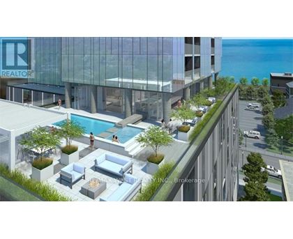 A modern building with a pool and lounge area on the roof.