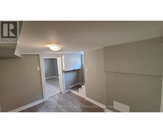 A room with a doorway leading to another room.