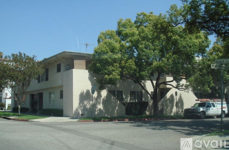 A building with a tree in front of it.