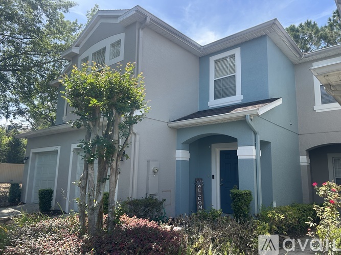 A house with a blue door and white trim.
