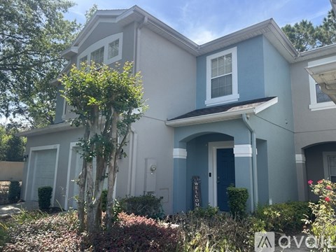 A house with a blue door and white trim.