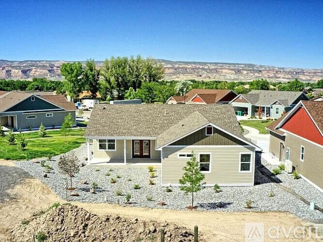 A row of houses with a mountain in the background.