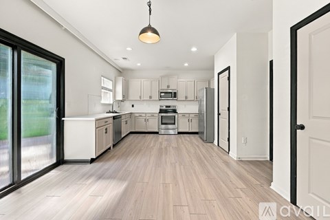 A floor plan of a second-floor apartment with three bedrooms and an optional deluxe bath.