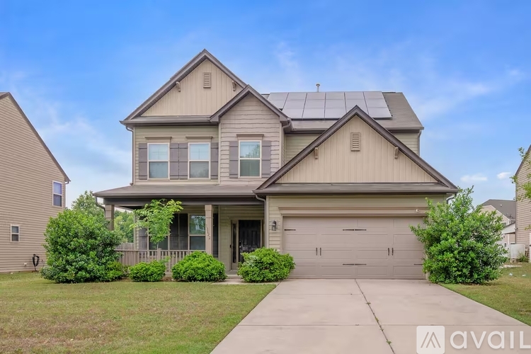 A two-story house with a garage is available for rent.