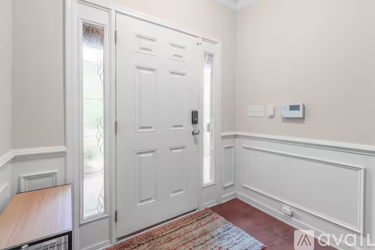 A white door with a glass window is closed.