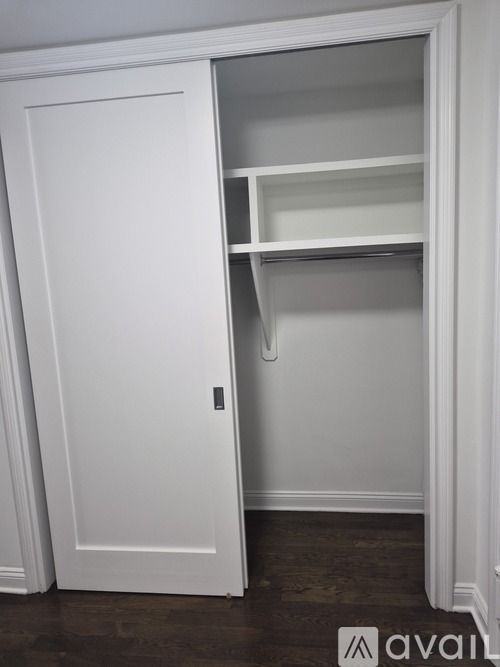 A white closet door is open.