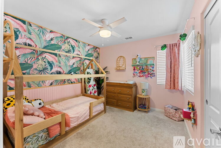 A child's bedroom with a bunk bed and a dresser.