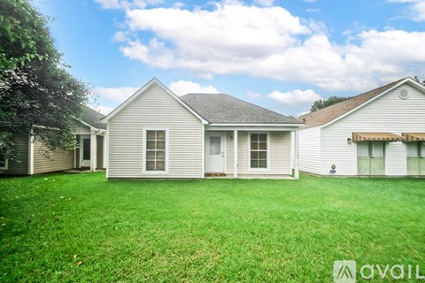 A house with a lawn in front of it is for sale.