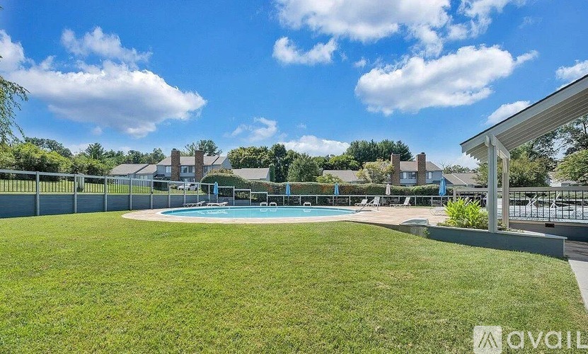 A sunny day at the pool with a clear blue sky.