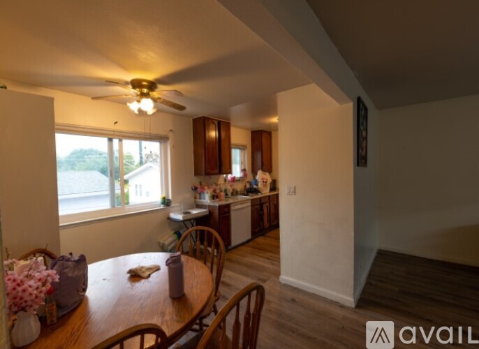 A dining room with a table and chairs is available for rent.